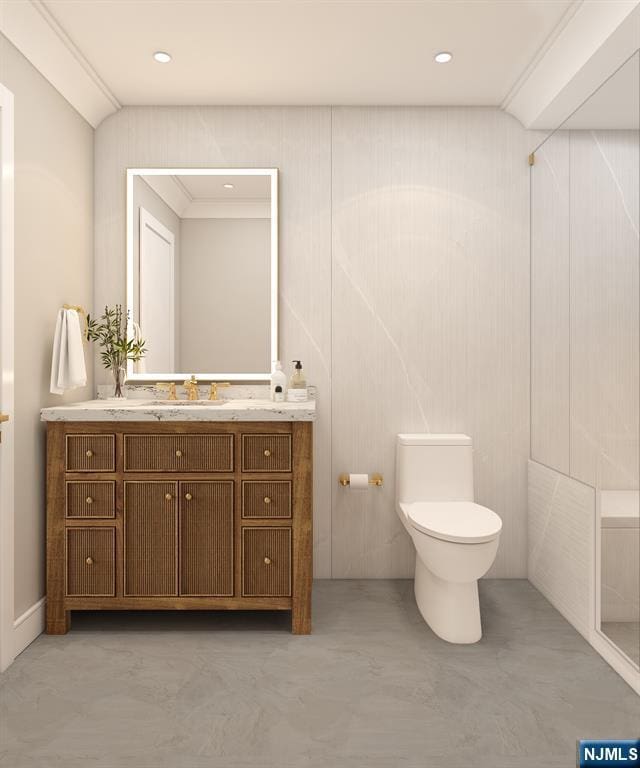 bathroom featuring vanity and toilet