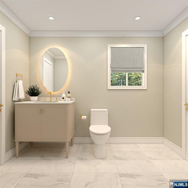 bathroom with crown molding, vanity, and toilet