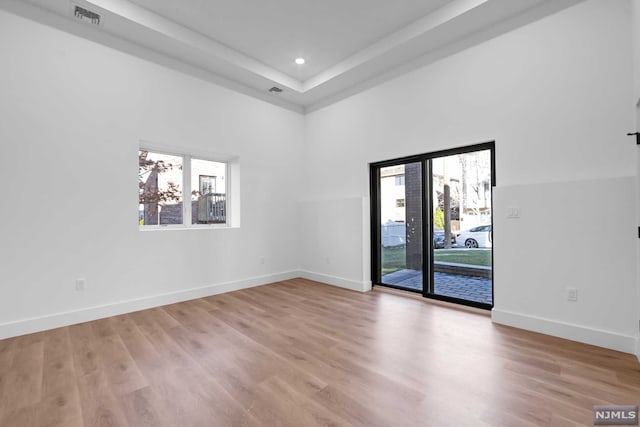 unfurnished room with light hardwood / wood-style flooring