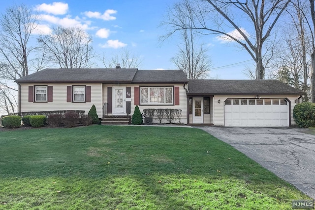 single story home with a front lawn and a garage