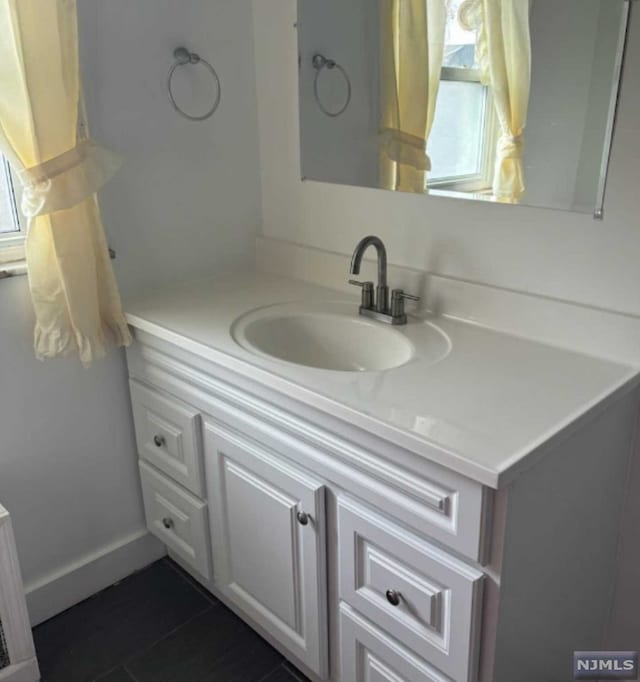 bathroom featuring tile patterned floors and vanity