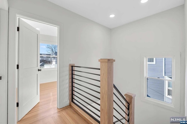 hall with light hardwood / wood-style flooring