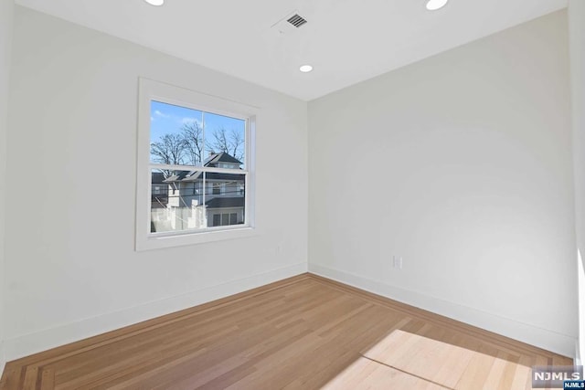 empty room featuring hardwood / wood-style flooring