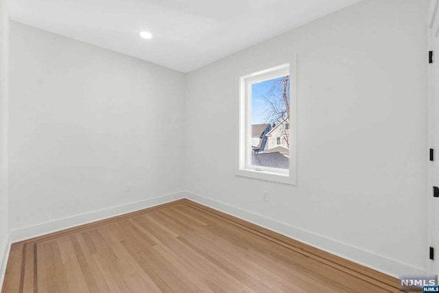 empty room featuring hardwood / wood-style floors