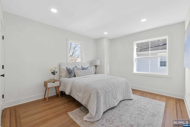 bedroom with wood-type flooring