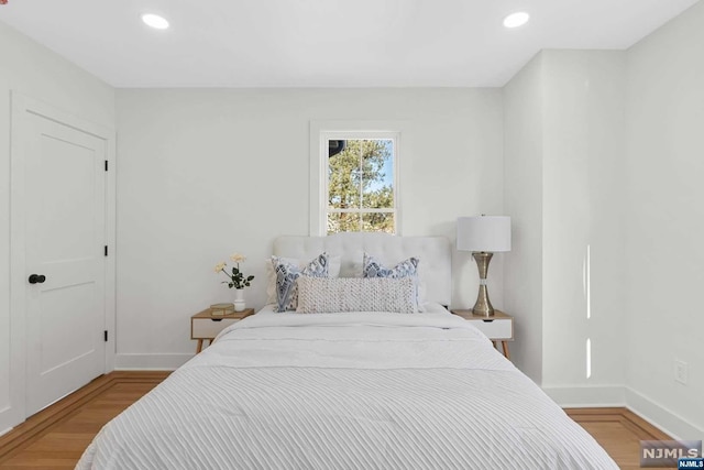 bedroom with light hardwood / wood-style flooring