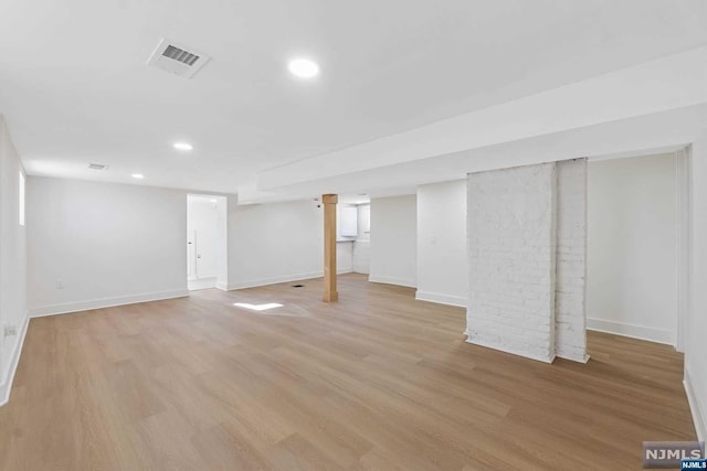 basement featuring light hardwood / wood-style floors