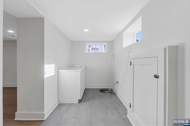 laundry room featuring light hardwood / wood-style floors