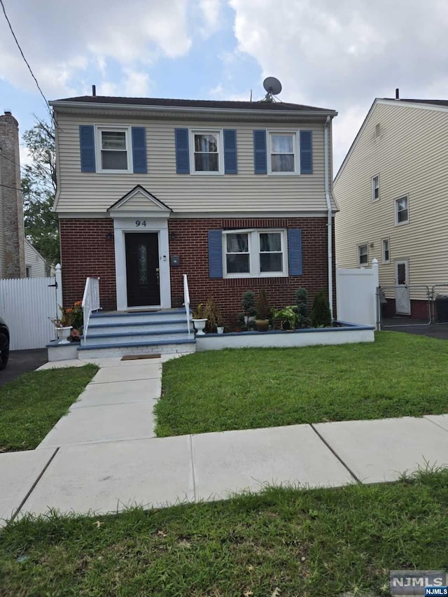 view of front of house with a front lawn