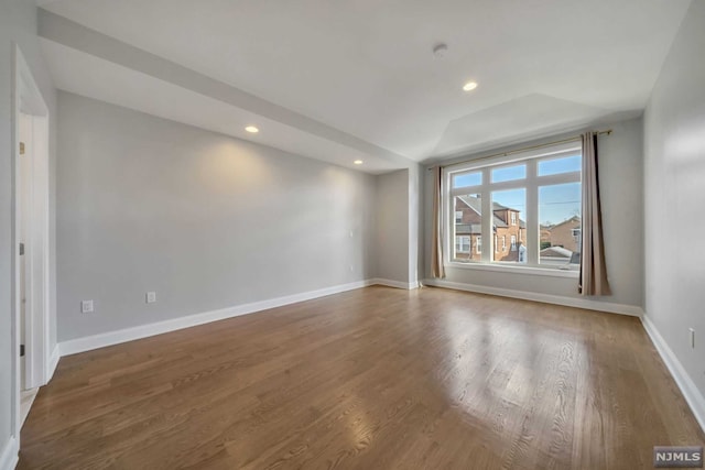 spare room with wood-type flooring