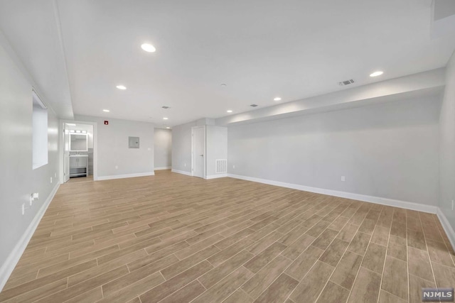 unfurnished living room featuring light wood-type flooring