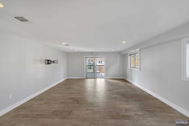 empty room featuring dark hardwood / wood-style flooring