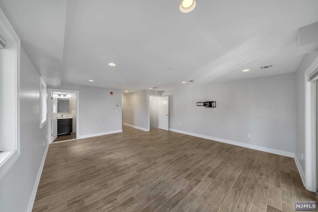 unfurnished living room with hardwood / wood-style flooring