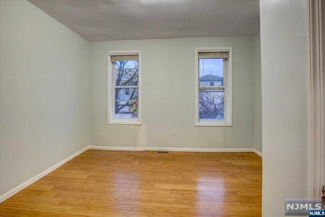 empty room featuring light hardwood / wood-style floors