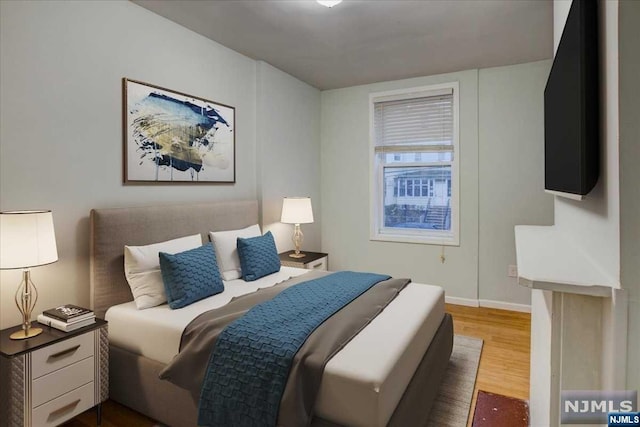 bedroom featuring dark wood-type flooring