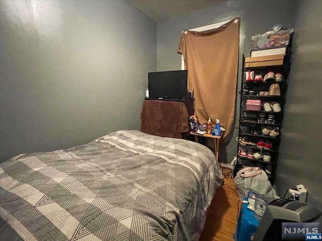 bedroom featuring hardwood / wood-style floors