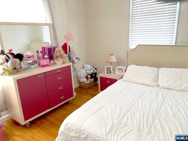 bedroom featuring wood-type flooring