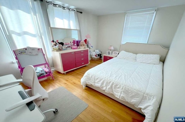 bedroom featuring hardwood / wood-style floors