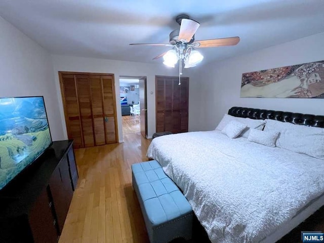 bedroom with light wood-type flooring and ceiling fan