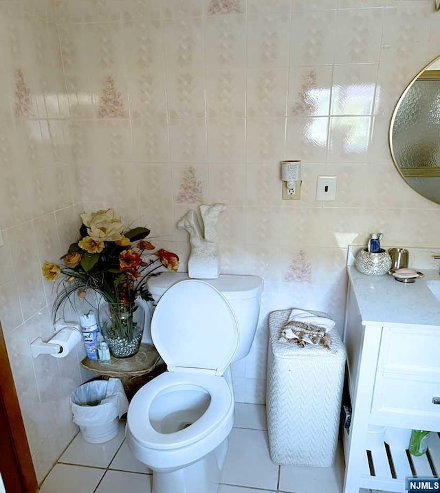 bathroom featuring tile patterned floors and tile walls