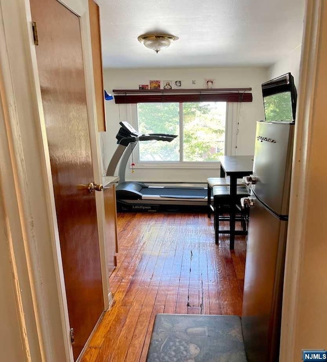 hallway with dark wood-type flooring