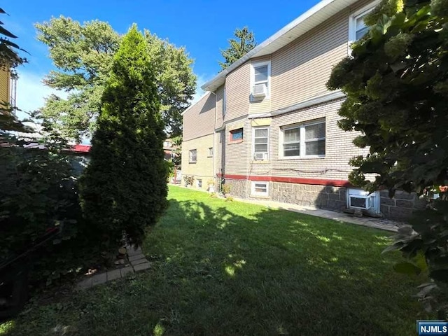 view of property exterior featuring a yard