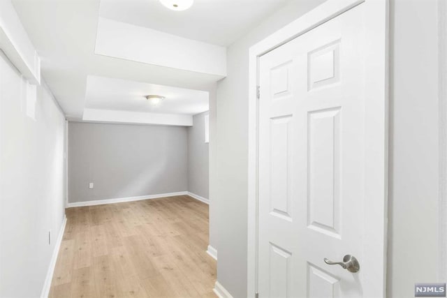 basement featuring light hardwood / wood-style flooring