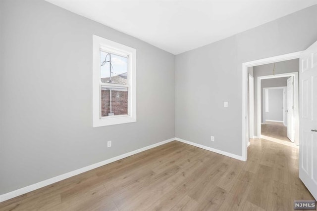 unfurnished room with light hardwood / wood-style floors