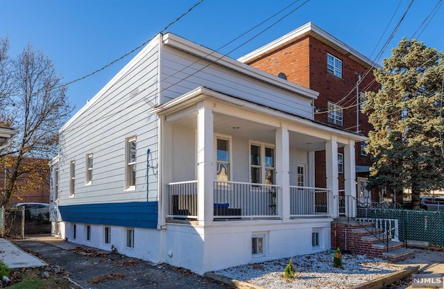 view of property exterior featuring covered porch