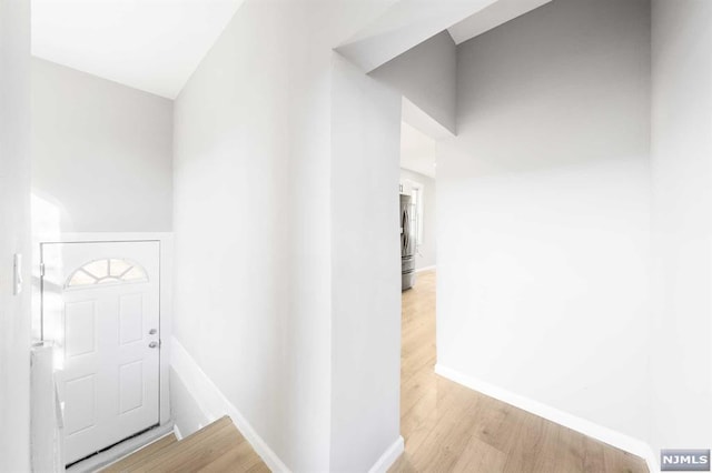 entryway with light hardwood / wood-style flooring