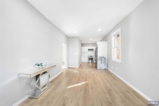 unfurnished living room featuring light hardwood / wood-style flooring