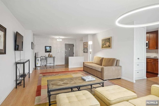 living room with light hardwood / wood-style floors