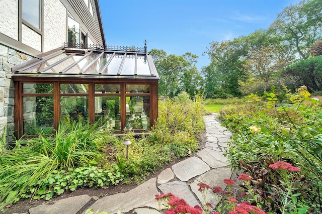 view of yard featuring a sunroom