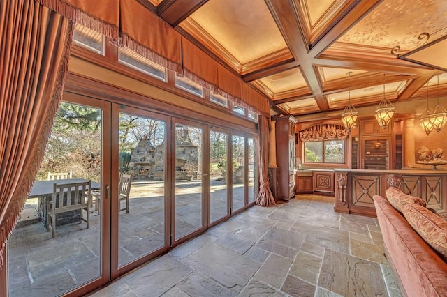 unfurnished sunroom with beamed ceiling, french doors, and coffered ceiling