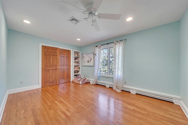 unfurnished bedroom featuring ceiling fan and light hardwood / wood-style flooring