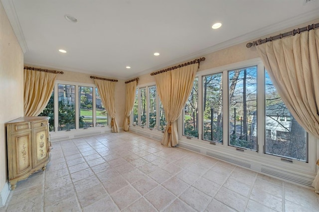 interior space with crown molding and a healthy amount of sunlight