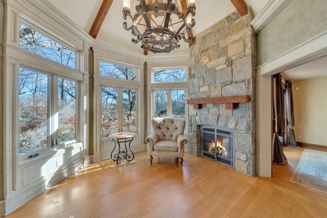 sitting room with a high ceiling and a wealth of natural light