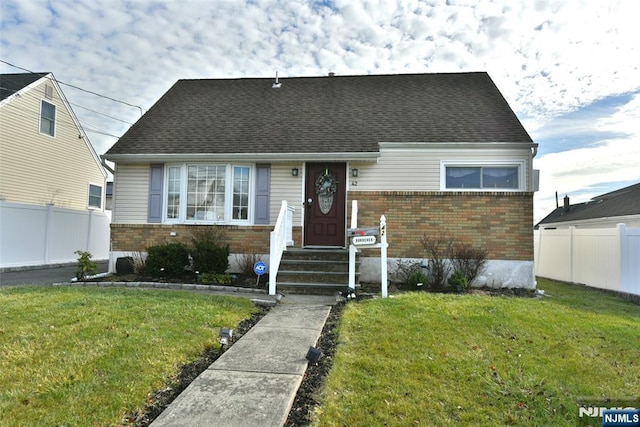 bungalow-style house with a front lawn