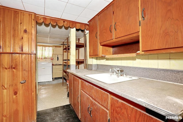 kitchen featuring sink and washer / dryer