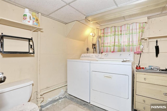 laundry area featuring washing machine and clothes dryer