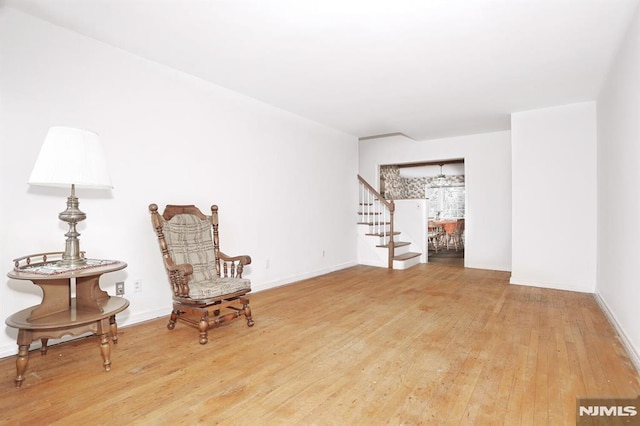 living area with hardwood / wood-style flooring