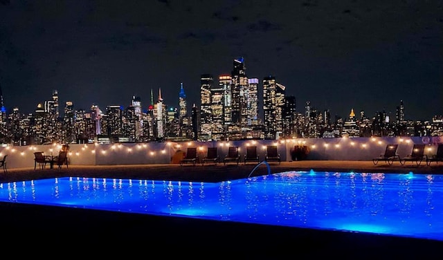 view of pool at night