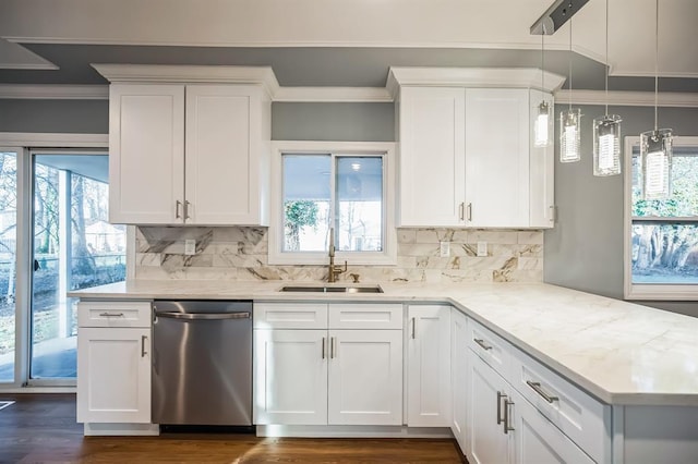 kitchen featuring stainless steel dishwasher, white cabinetry, and hanging light fixtures