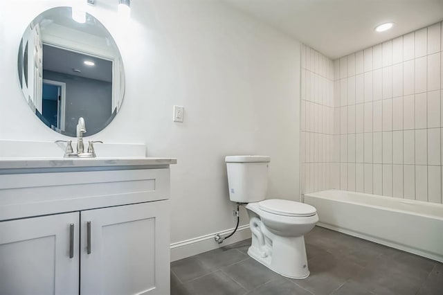 full bathroom featuring tile patterned flooring, tiled shower / bath combo, toilet, and vanity