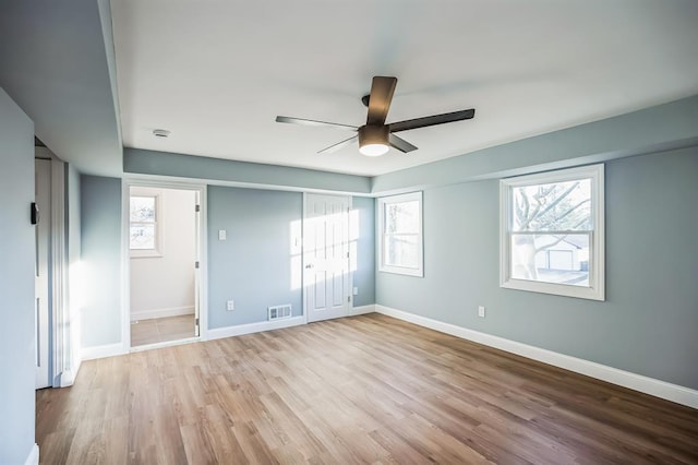 unfurnished bedroom with light hardwood / wood-style floors and ceiling fan