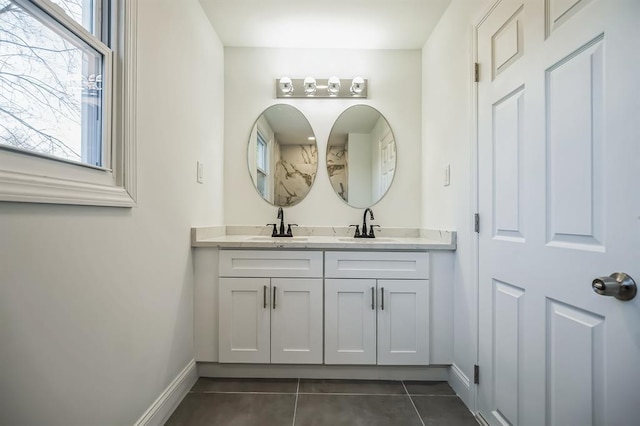 bathroom with tile patterned flooring and vanity