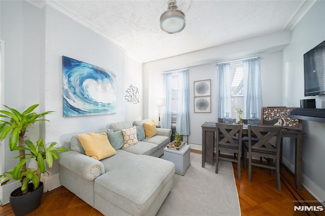 living room featuring parquet floors and a textured ceiling