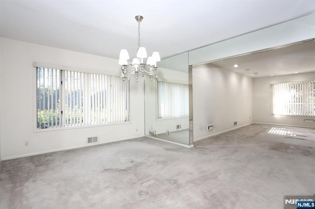 interior space featuring an inviting chandelier and carpet