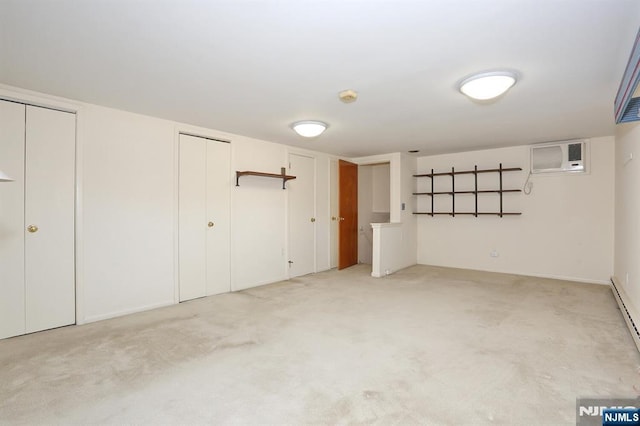 basement with a wall mounted air conditioner and light carpet