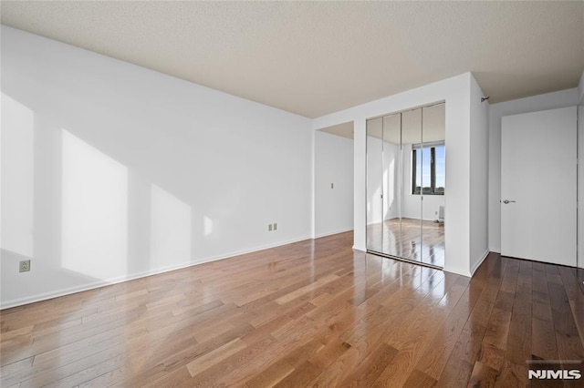 empty room with light hardwood / wood-style floors